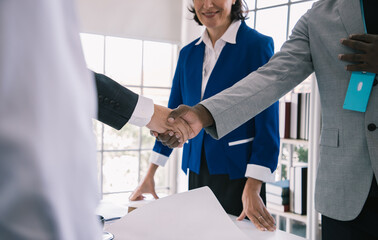 Architect and Business engineer construction workers shaking hands while working for teamwork and cooperation concept after finish an agreement in the office