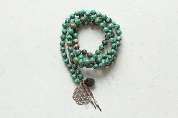 Rosary mala 108 beads from natural stones Chrysocolla Turquoise. Author's jewelry from natural stones, Buddhism, mantra, prayer, rosary from stones for prayer, beauty. Long beads from stones necklace - obrazy, fototapety, plakaty