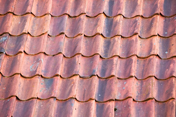 Background of red roof made of old tiles.