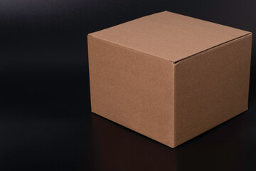 Brown cardboard box isolated on black background