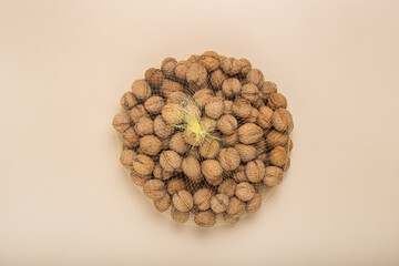 Walnuts in a grid on a light background. Top view, flat lay.
