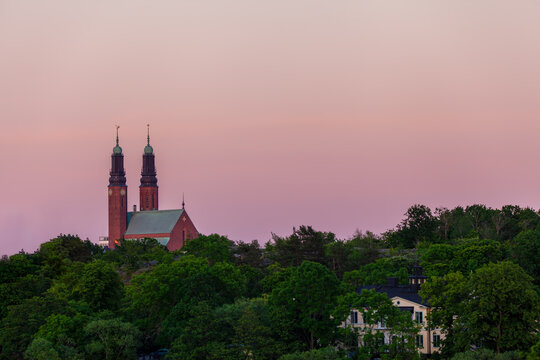 Typical pale late evening light during summer in Scandinavia. The Högalid Church on the island Södermalm in Stockholm, Sweden. © Ojvind