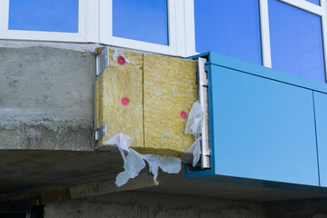Insulation facade close-up. Facade insulation. Insulation of the ventilated facade of the building.