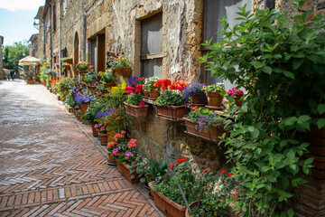 Fototapeta na wymiar Tuscany, Russia, May 2018, street in flowers in the medieval town of Sovana