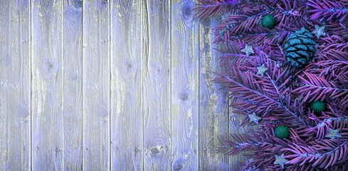 Merry Christmas,Happy New Year banner.Xmas violet wood texture,wooden planks boards background with decorative design elements.Pine spruce tree branches,stars,pine cone,ball bauble.Winter Frame.Border