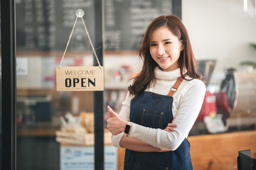 The shop owner turned the open sign. ready to serve