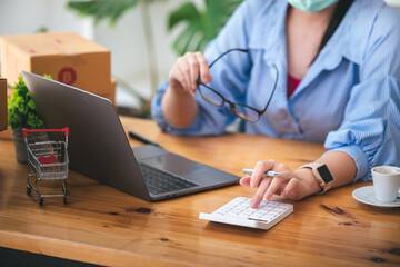 Small start-up business owners checking parcels at work, freelancers, salespeople, checking production orders. Pack products for delivery to customers Sell ​​Ecommerce Shipping Ideas