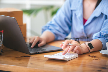 Small start-up business owners checking parcels at work, freelancers, salespeople, checking production orders. Pack products for delivery to customers Sell ​​Ecommerce Shipping Ideas