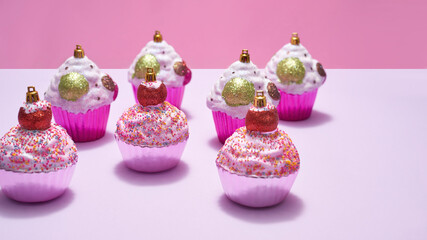 Different christmas baubles in form of cupcake