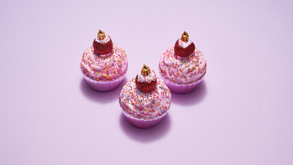 Set of colorful Xmas baubles in form of cupcake