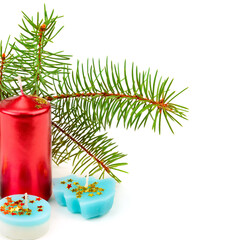 Christmas candle and spruce branch isolated on white . Place for your text.