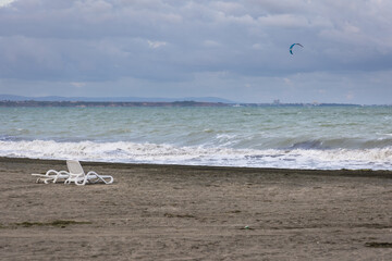 Sunbeds on a empty Black Sea beach in Burgas city, Bulgaria