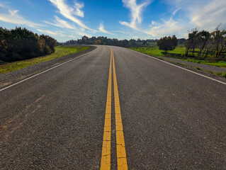 Yellow line on a open road on a levee in California