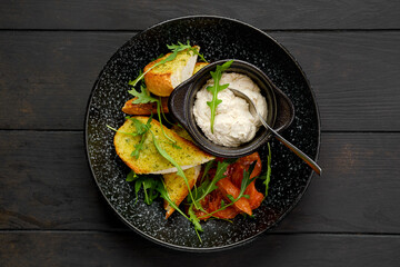 Top view of toasted garlic bread with sour curd and braised tomato