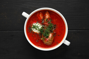 Overhead view of hot tomato soup with beef rib
