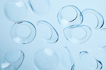 contact lenses on blue background close up view   - Image