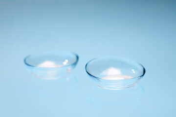 contact lenses on blue backgroundn close up view  - Image