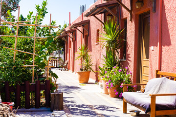 Fototapeta na wymiar Colorful Living, veranda of Red House with Palm Tree,