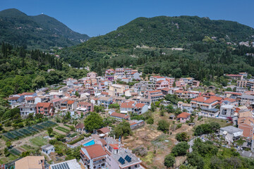 Fototapeta na wymiar Aerial drone photo of Benitses town on the Ionian Sea shore on Corfu Island, Greece