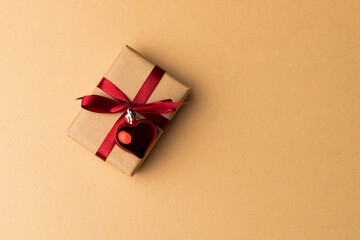 Box wrapped in craft paper on craft paper background