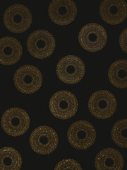 golden mandala on a black background, shiny patterns on a dark background, glitter, golden sequin ornament on a black background, shining sequins