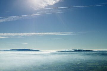 Landscape with mountains covered with fog
