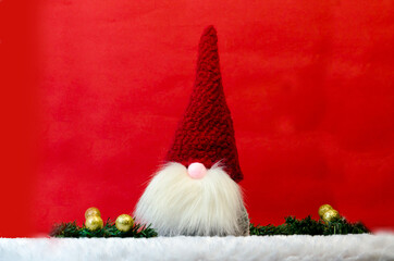 Obraz na płótnie Canvas christmas new year gnomes on a red background 2022
