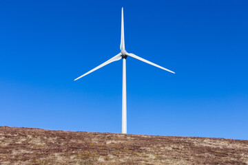 Windpark at the Handalm mountain range in Styria, Austria in autumn with blue clear skies