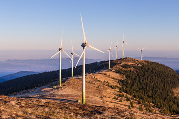 Windpark at the Handalm mountain range in Styria, Austria in autumn with blue clear skies