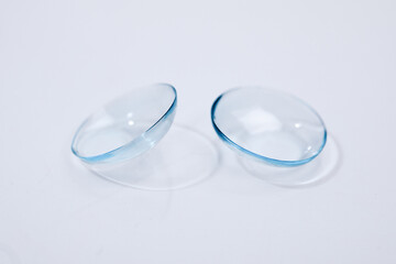 contact lenses on blue background close up view   - Image