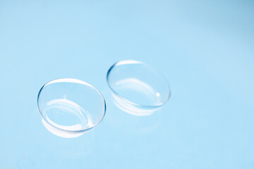 contact lenses on blue backgroundn close up view  - Image