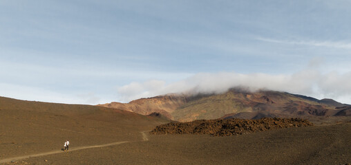 Girl walking towards the volcano