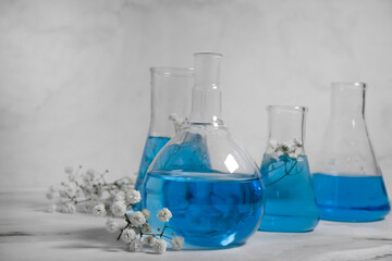 laboratory flask flower on a light background