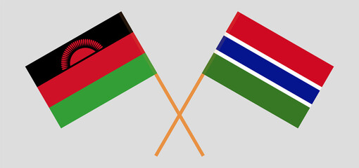 Crossed flags of Malawi and the Gambia. Official colors. Correct proportion