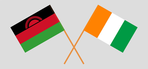 Crossed flags of Malawi and Republic of Ivory Coast. Official colors. Correct proportion