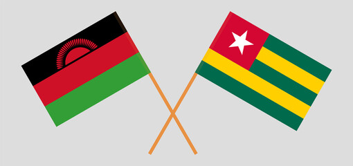 Crossed flags of Malawi and Togo. Official colors. Correct proportion