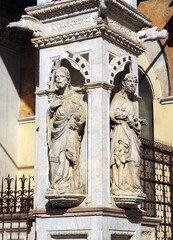 Fototapeta na wymiar Artful Sculptures At The City Hall Palazzo Publico At Piazza Del Campo In Siena Tuscany Italy On A Beautiful Spring Day