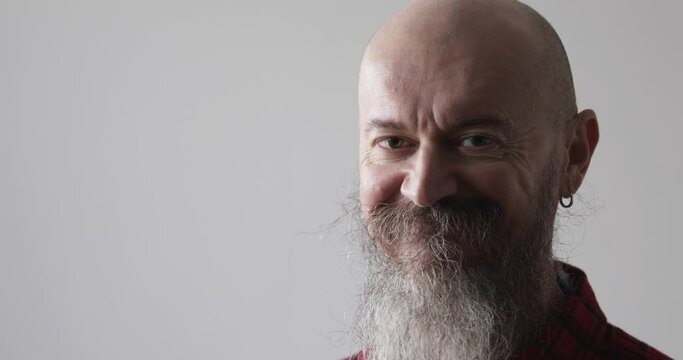 Portrait Of Cheerful 50 Years Old Mid Adult Man With Beard Looking At Camera Smiling Making Positive Face Gesture Over White Background