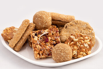 Makar Sankranti Or Lohri Mithai viz Meetha Chikki, Gud Patti, Gur Mungfali Gulab Chiki, Gajak Laddu, Tilgul Ladoo, Gajjak Rolls, Gazak Burfi, Tilkut And Gachak Barfi Is Made Of Til And Moongfali
