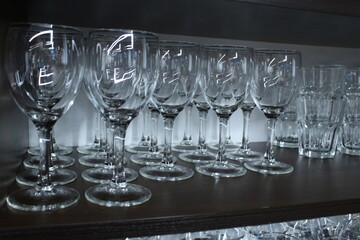 glasses glasses glasses pure stand in storage in a row. Glassware
