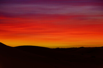 The Colors Of The Sky Glow As The Sun Rises On The Sahara Desert In Morocco, Arica