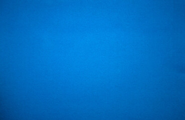 The texture of pure blue paper for text. Blue background.The cardboard is blue.Craft paper for applications.