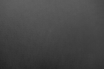 Texture of black cardboard. A sheet of black paper. Dark background for the text. Gloomy background for the ad. Black application form.