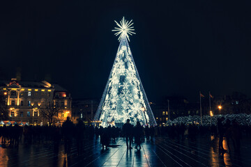 Beautiful white Christmas tree with snowflakes in Vilnius Cathedral square, Lithuania, Europe, no...