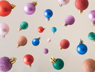 Colorful Christmas ornament flying background. Christmas bauble in the air aesthetic retro concept.