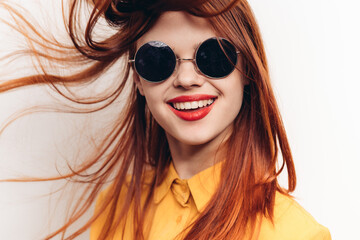 glamorous woman in sunglasses red hair close-ups