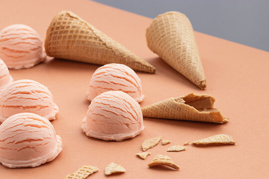 Ice cream scoop and waffle cones on table