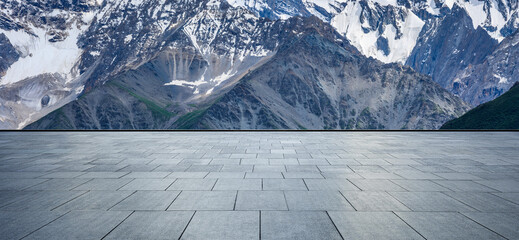 Empty square floor and snow mountain background