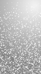 Magic stars Christmas background. Subtle flying snow flakes and stars on grey background. Appealing winter silver snowflake overlay template. Classy vertical illustration.