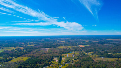 Aerial view of deep blue Florida skies over farm plots in North Florida